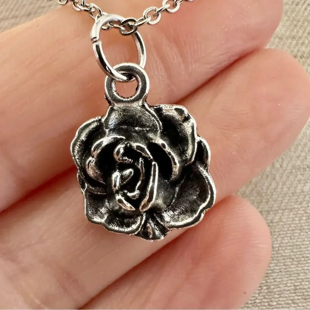 Silver tone rose pendant necklace